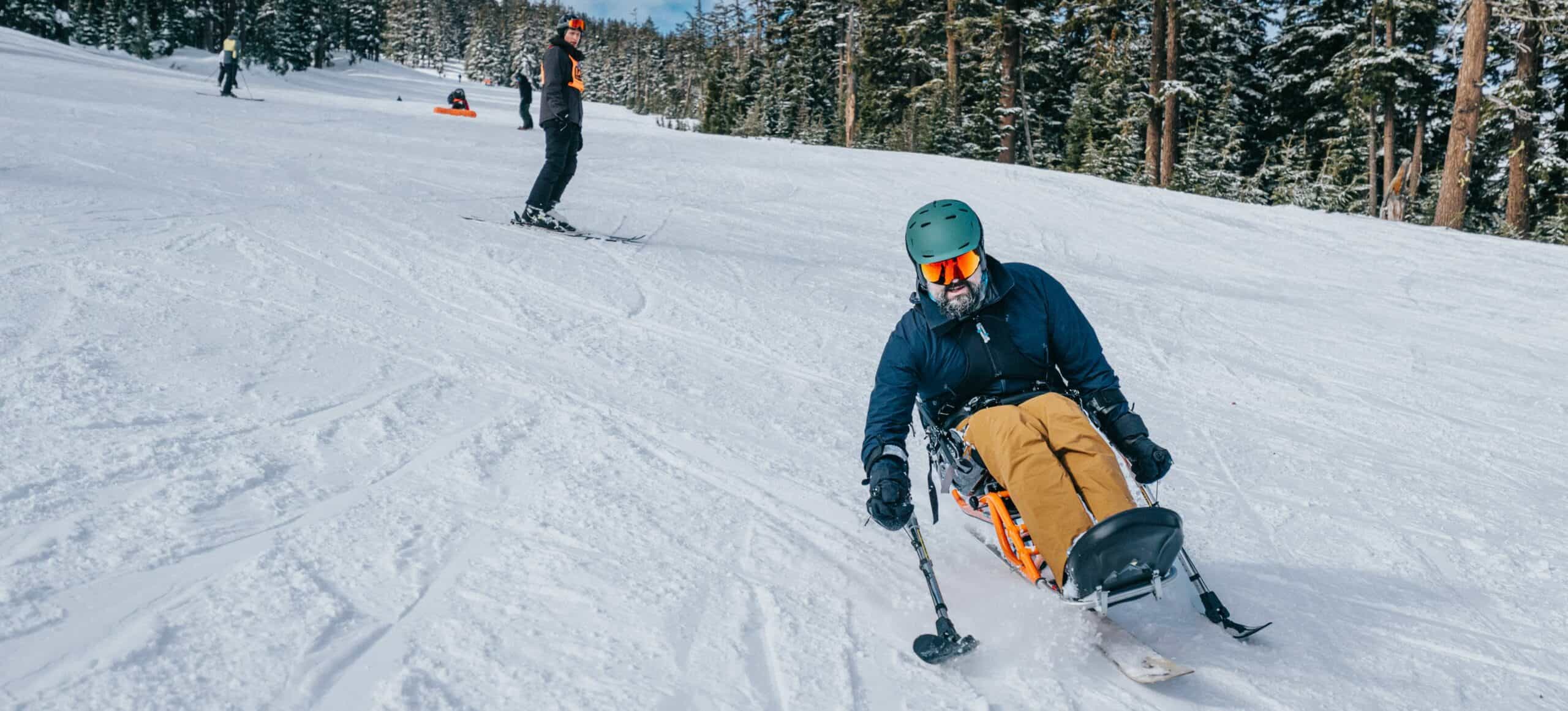 Person in a wheelchair enjoying skiing on snowy slopes in the USA.