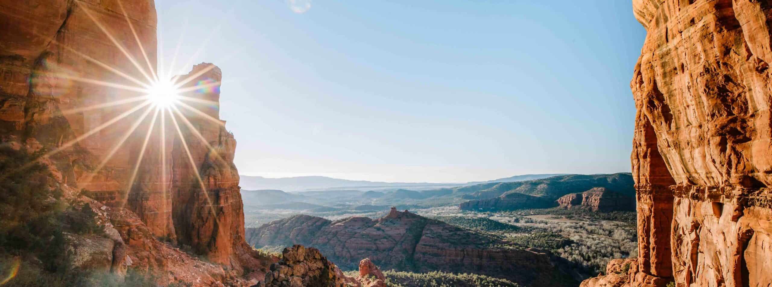 Breathtaking canyon landscape with sunlight shining over cliffs.