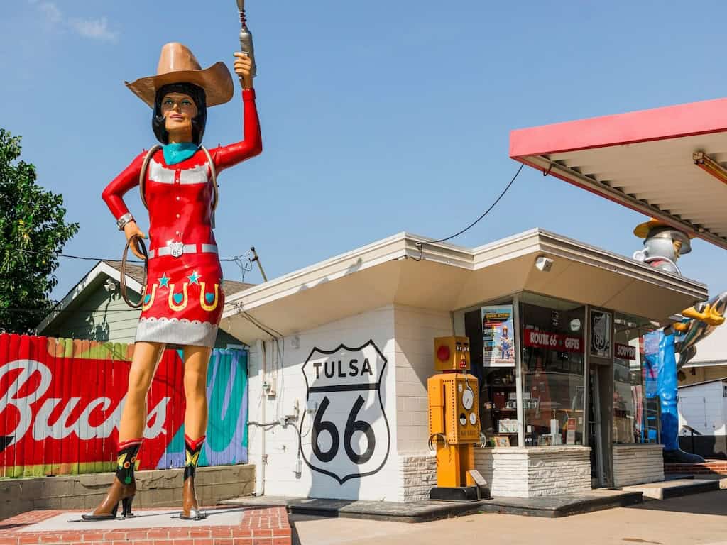 Colorful Route 66 neon sign outside a vintage diner in Tulsa, Oklahoma.